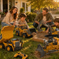 Family playing with YIGONG remote control construction toy vehicles in a sunny backyard