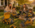 Family playing with YIGONG remote control construction toy vehicles in a sunny backyard